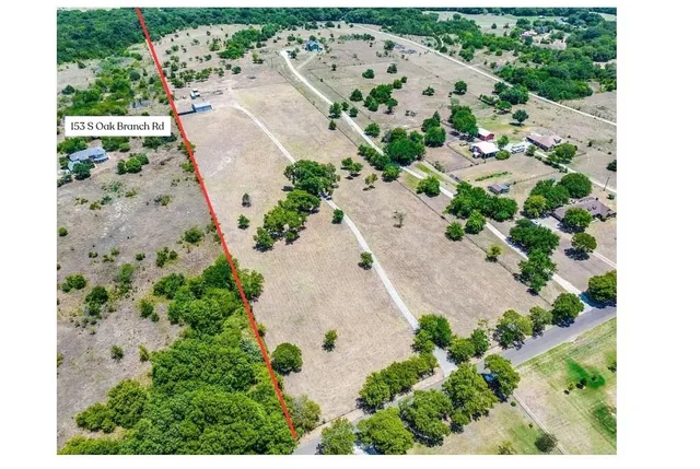 a view of a town with mountains in the background