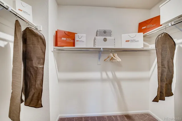 an aerial view of a house with a swimming pool and outdoor seating