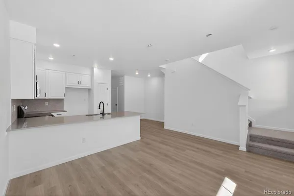 a view of kitchen with wooden floor