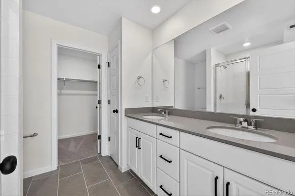 a bathroom with a granite countertop sink a mirror and a