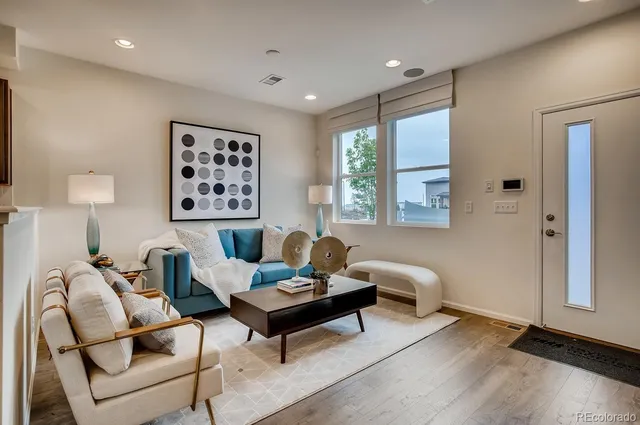 a view of a dining room with furniture and a potted plant