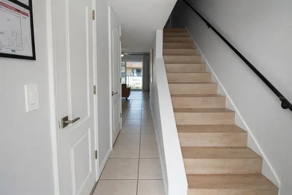 a view of staircase with white walls