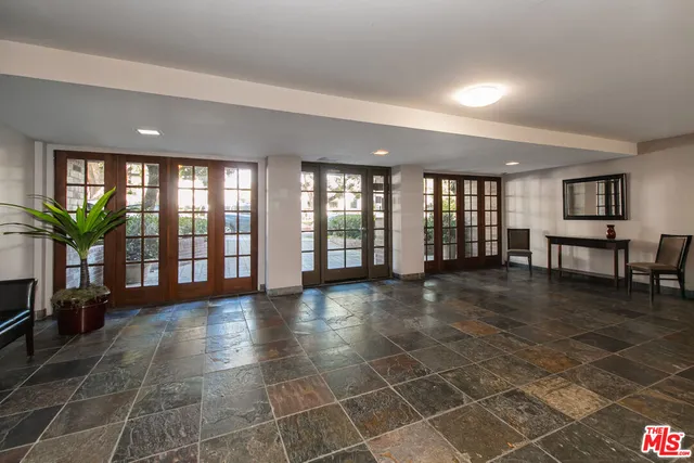 a view of a hallway with seating area