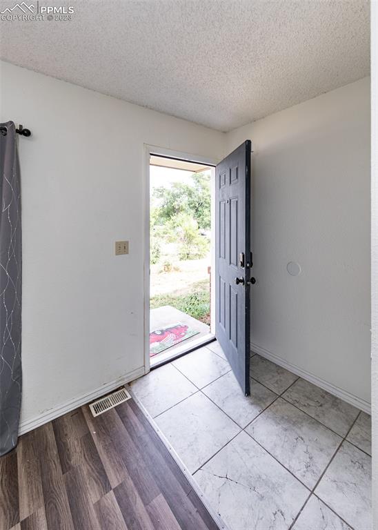 9765 Wineglass Road Fountain, CO 80817 - Photo 2 of 37 a view of an empty room and window
