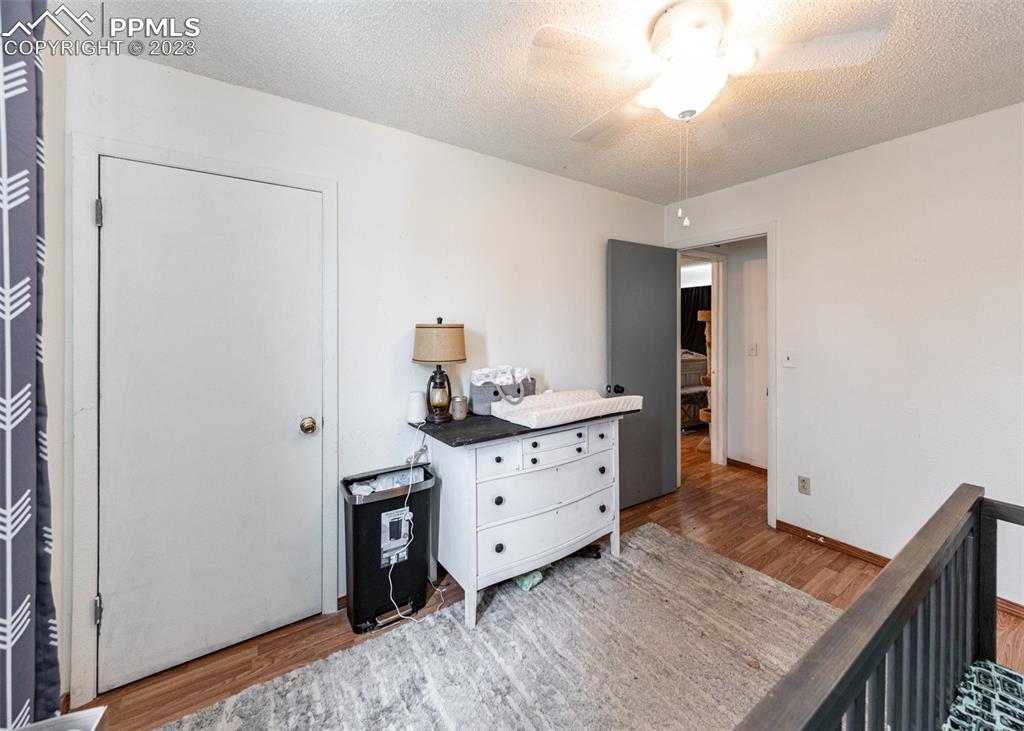 9765 Wineglass Road Fountain, CO 80817 - Photo 26 of 37 a room with a dresser and a mirror