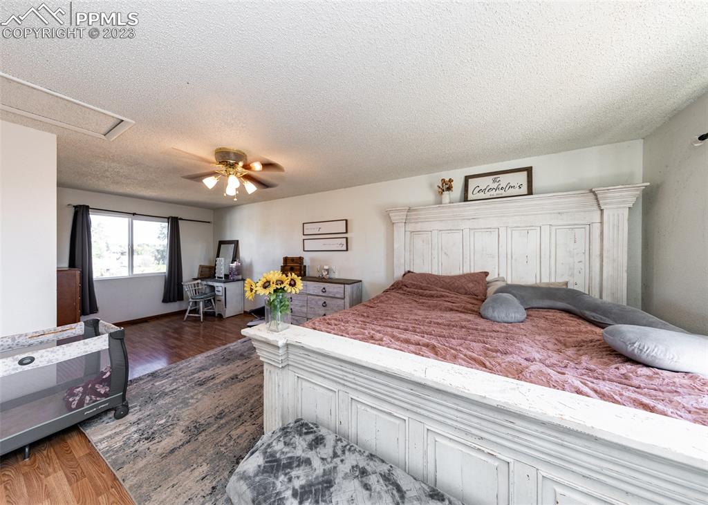 9765 Wineglass Road Fountain, CO 80817 - Photo 32 of 37 a bed room with furniture and window