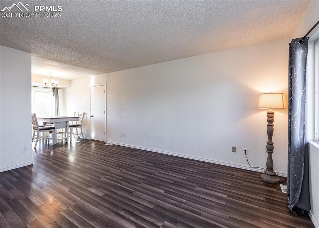 9765 Wineglass Road Fountain, CO 80817 - Photo 7 of 37 a view of empty room with wooden floor