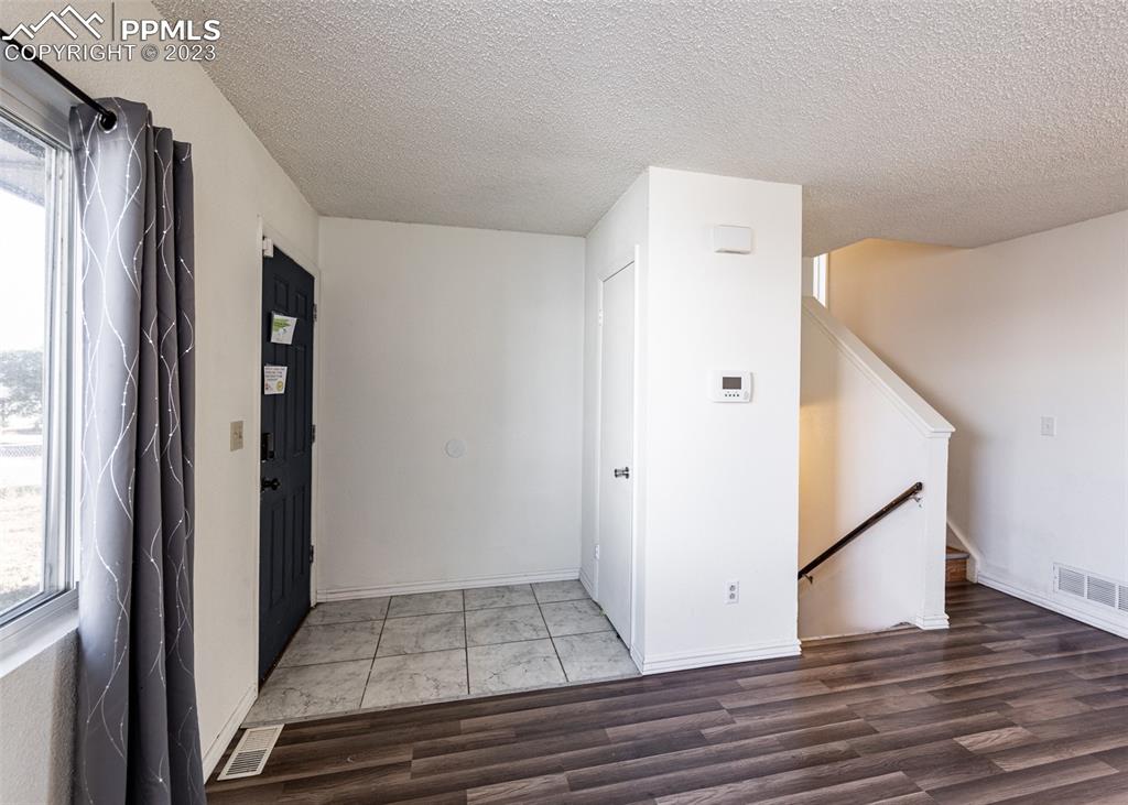9765 Wineglass Road Fountain, CO 80817 - Photo 8 of 37 wooden floor in an empty room