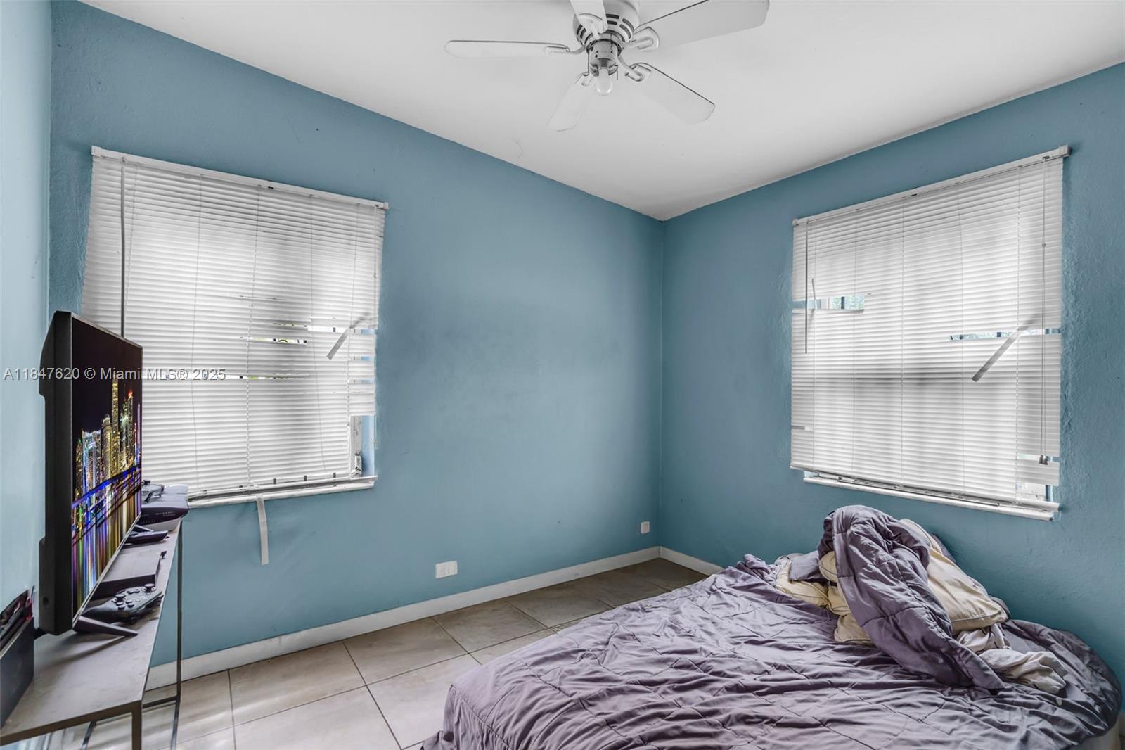1900 Service Road Opa-Locka, FL 33054 - Photo 12 of 24 a bedroom with a bed and a window