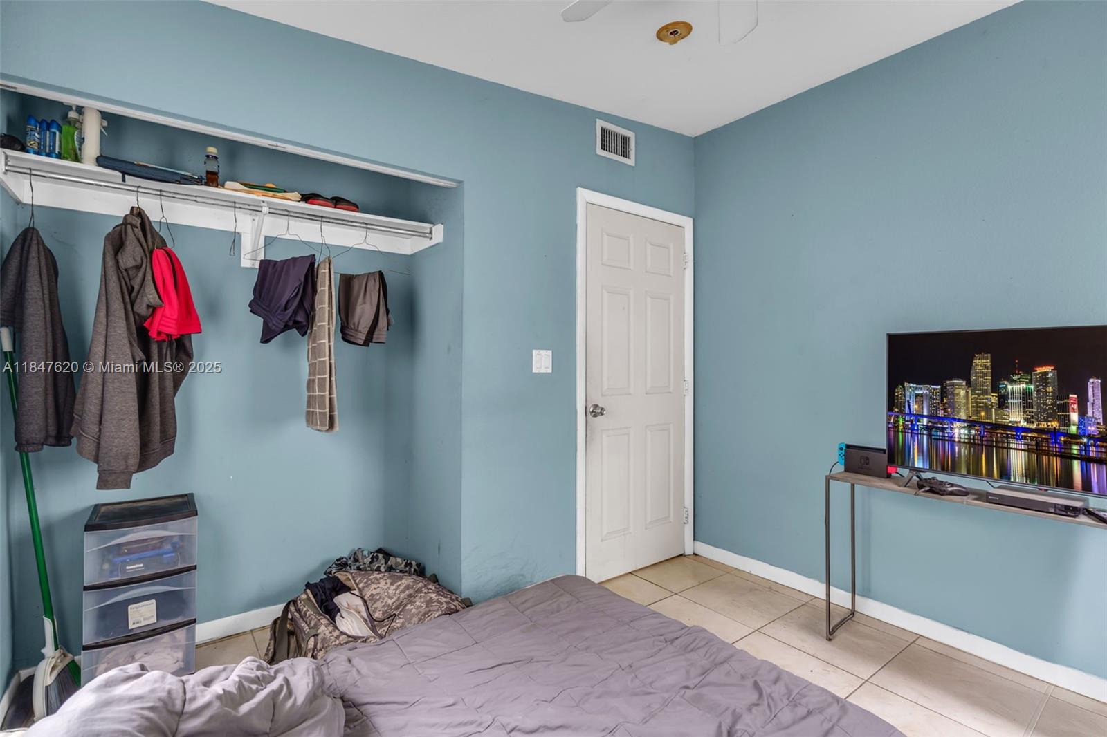 1900 Service Road Opa-Locka, FL 33054 - Photo 13 of 24 a bedroom with a bed and a closet