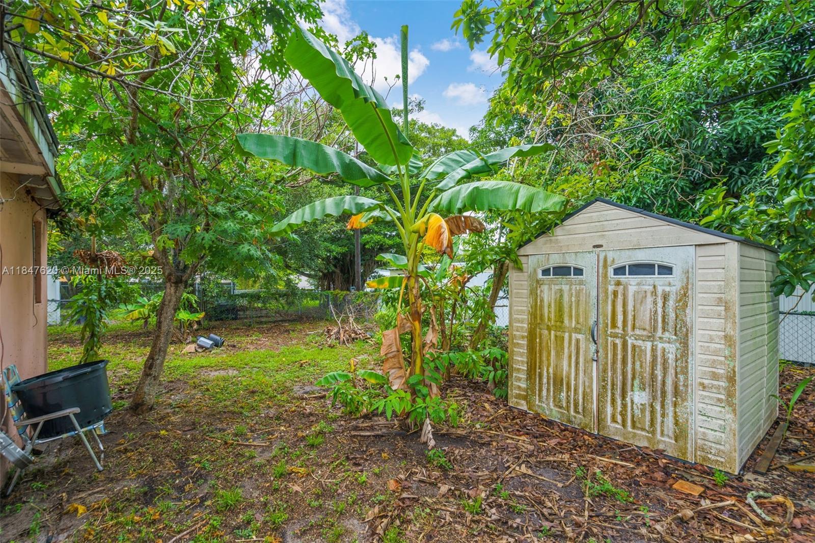 1900 Service Road Opa-Locka, FL 33054 - Photo 19 of 24 a front view of a house with garden