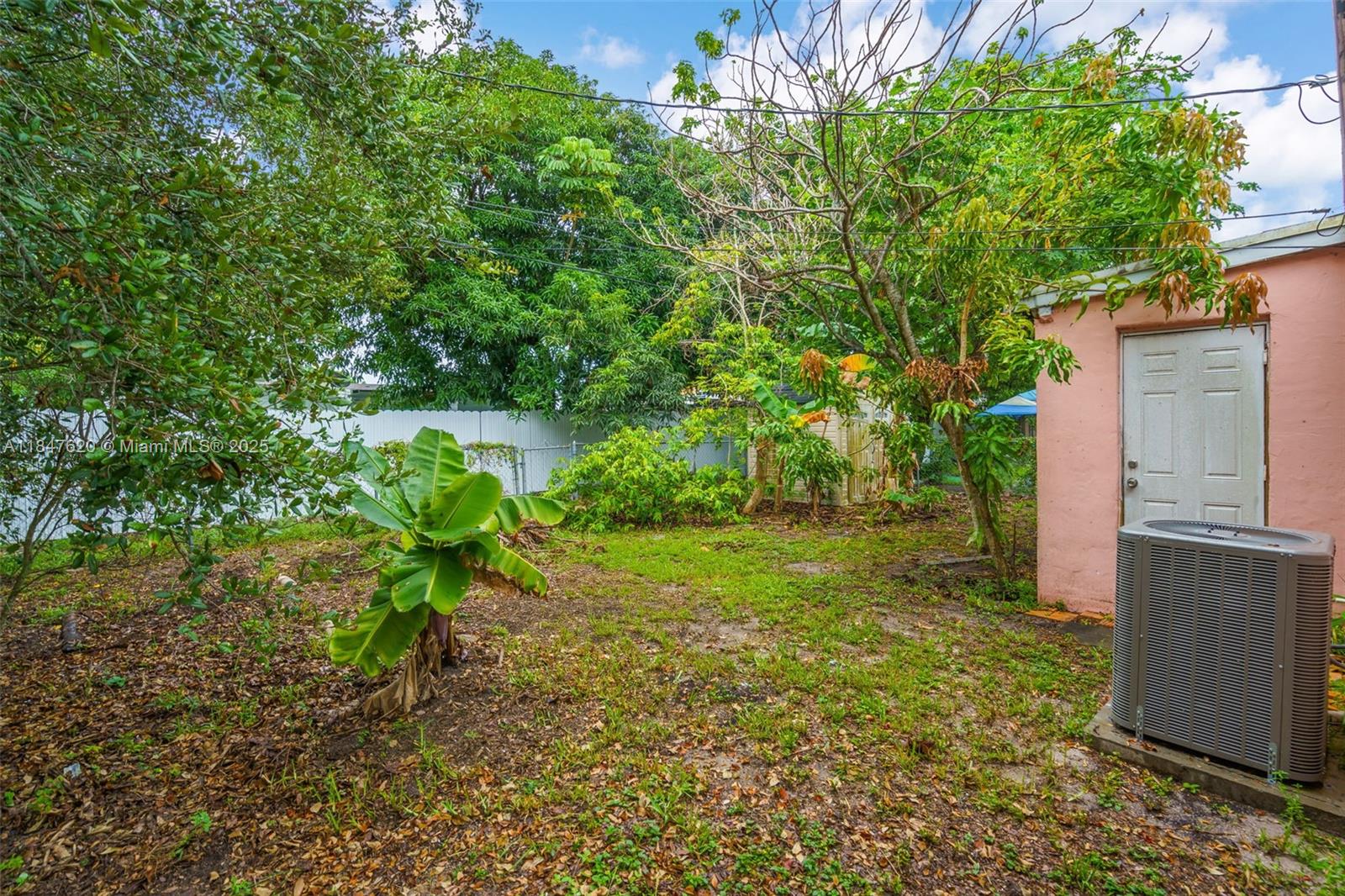 1900 Service Road Opa-Locka, FL 33054 - Photo 20 of 24 a backyard of a house with lots of green space