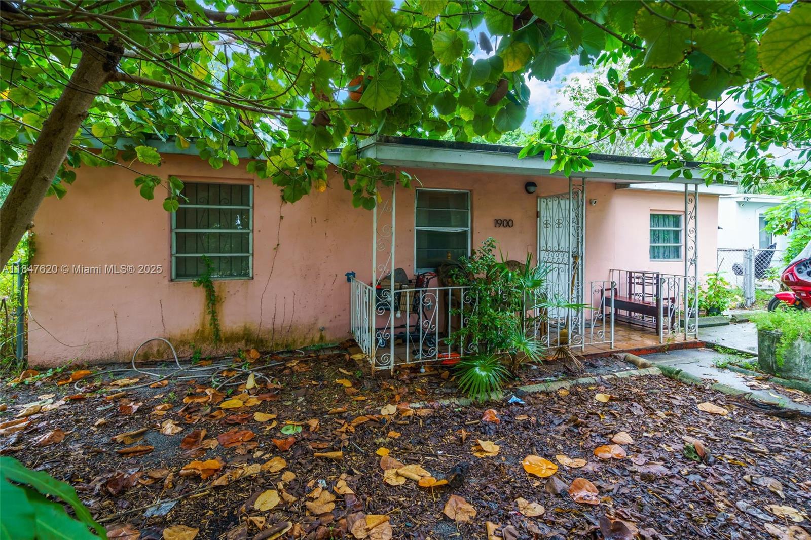 1900 Service Road Opa-Locka, FL 33054 - Photo 2 of 24 a front view of a house with garden