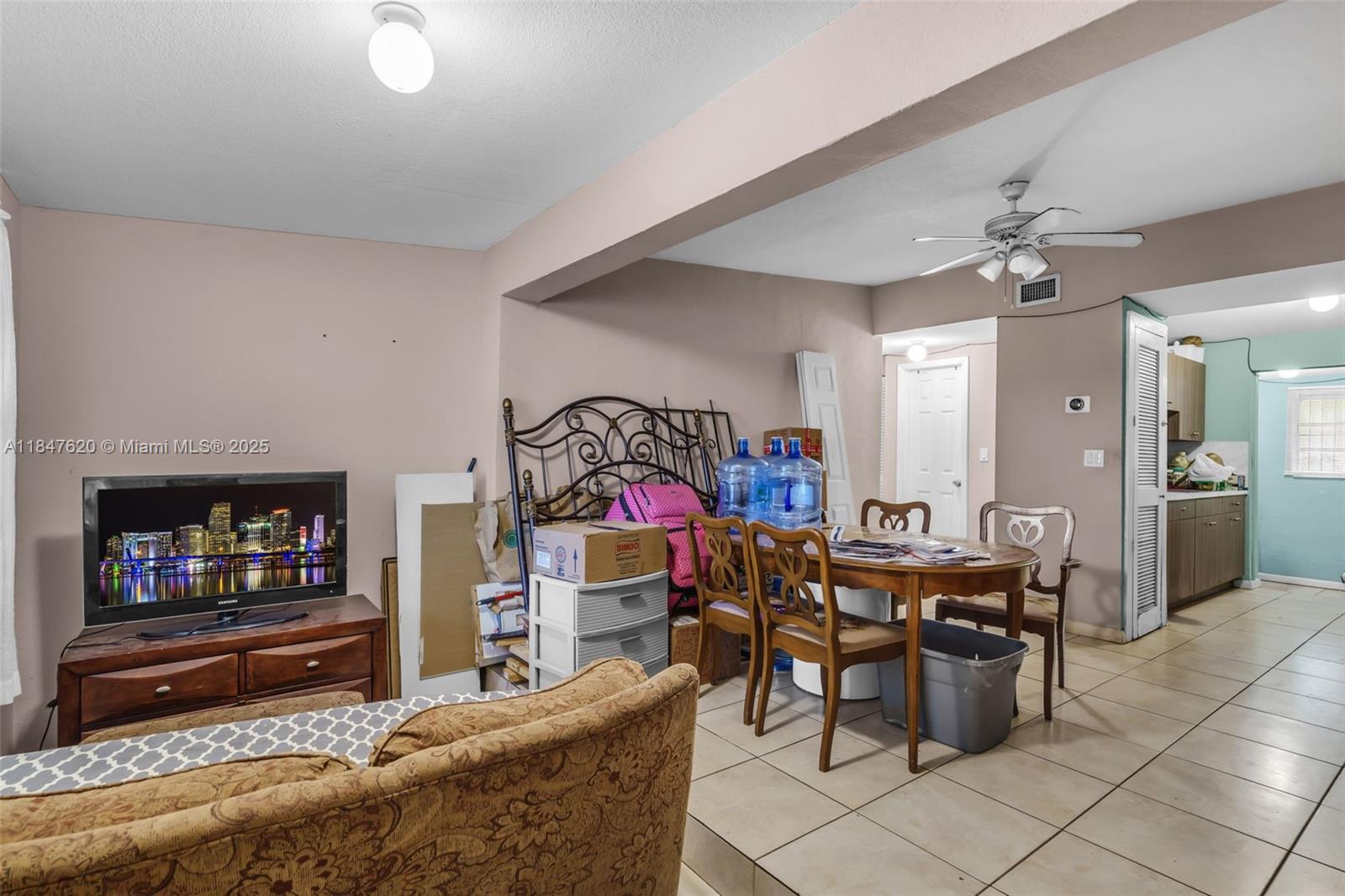 1900 Service Road Opa-Locka, FL 33054 - Photo 4 of 24 a living room with furniture and a flat screen tv