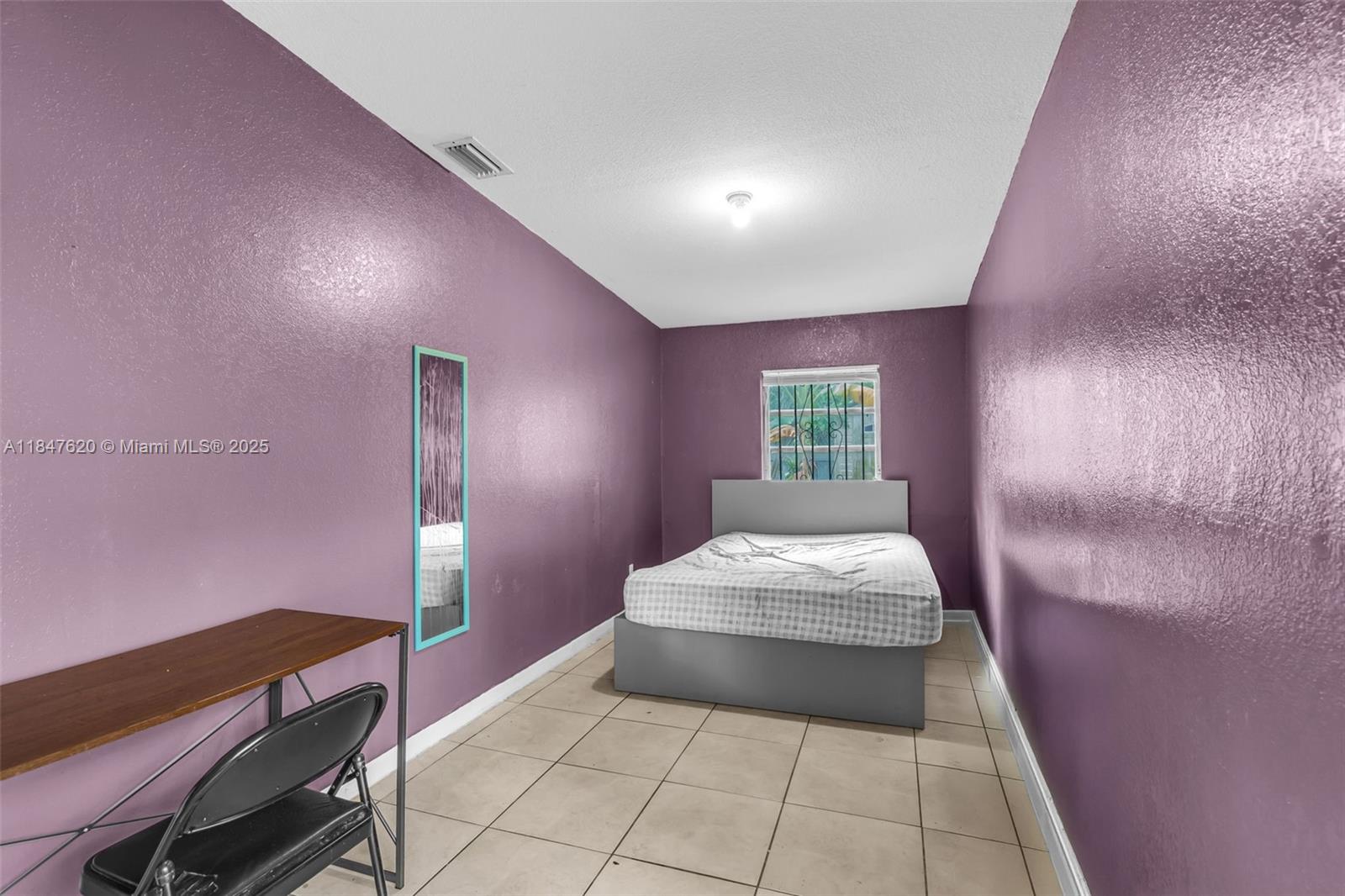 1900 Service Road Opa-Locka, FL 33054 - Photo 10 of 24 a bedroom with a bed and window