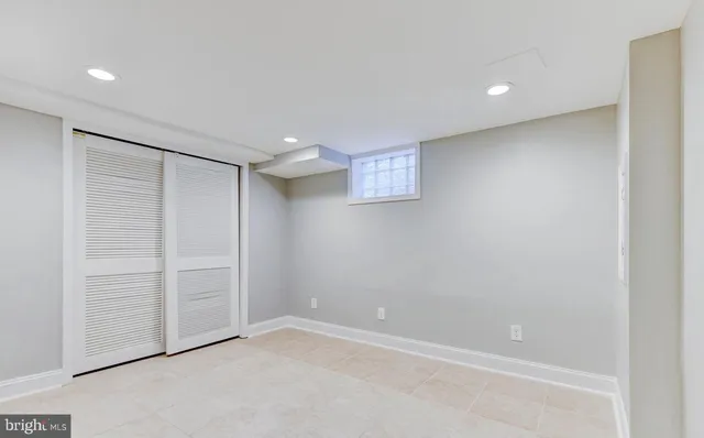 a kitchen with white cabinets