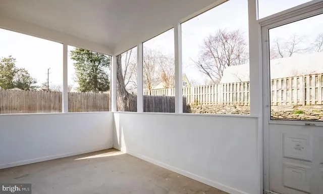 a view of a backyard with a fence