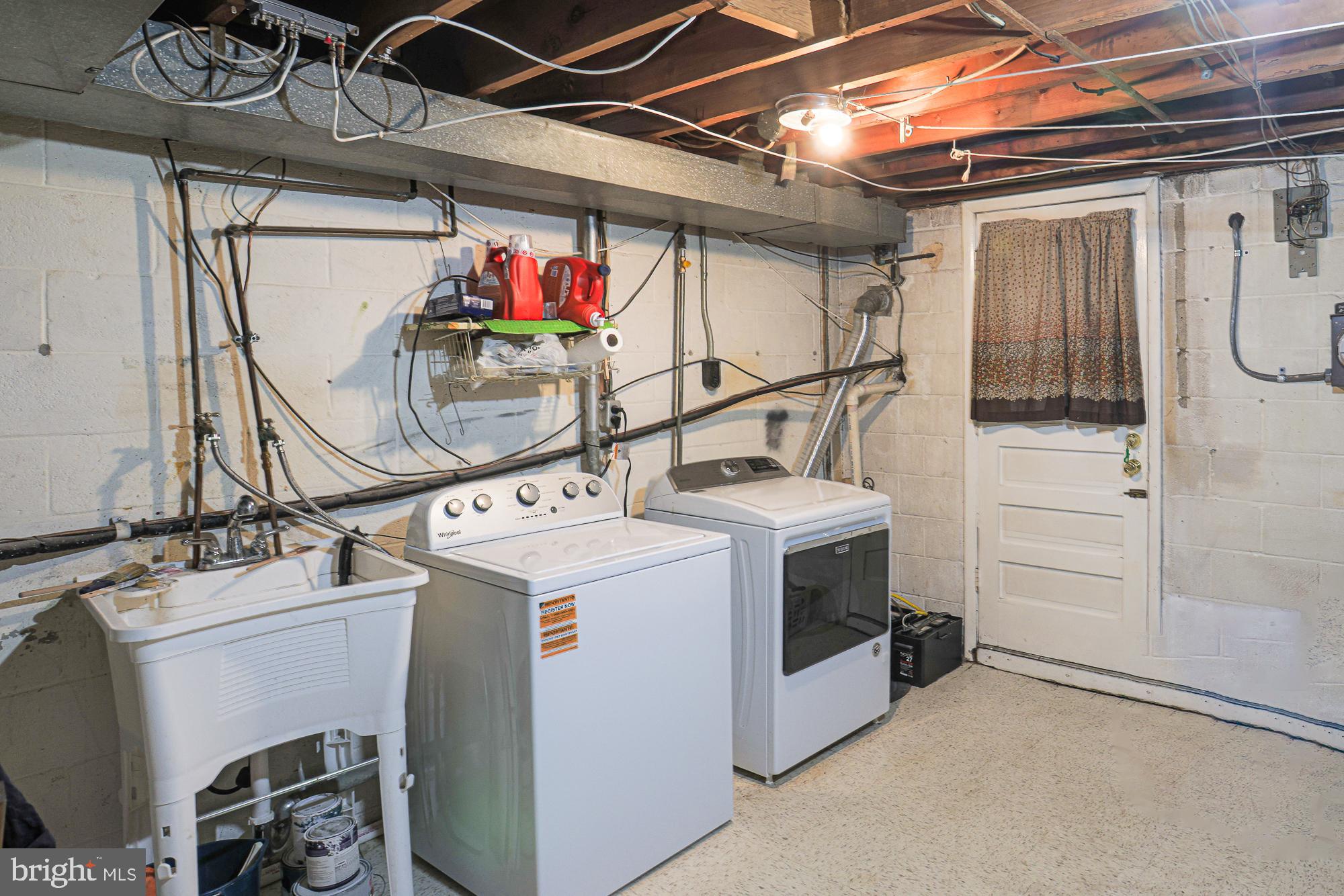 8739 Cimarron Circle Baltimore, MD 21234 - Photo 36 of 46 Lower Level Laundry Room with Walk Out Door