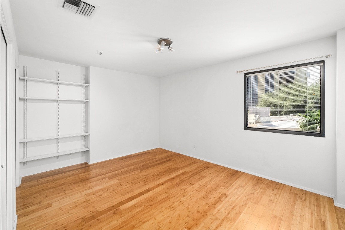 40 North Interstate Highway 35, Unit 3D3 Austin, TX 78701 - Photo 20 of 40 a view of empty room with wooden floor and fan