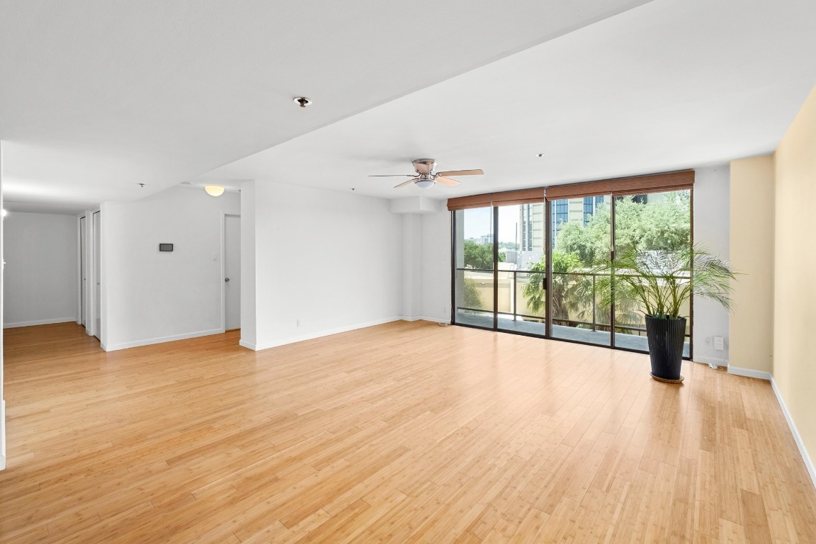 40 North Interstate Highway 35, Unit 3D3 Austin, TX 78701 - Photo 5 of 40 a view of an empty room with wooden floor and a window