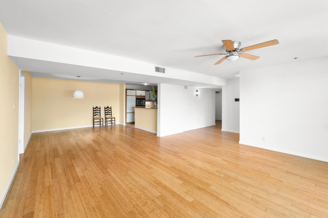 40 North Interstate Highway 35, Unit 3D3 Austin, TX 78701 - Photo 6 of 40 a view of a room with wooden floor and ceiling fan