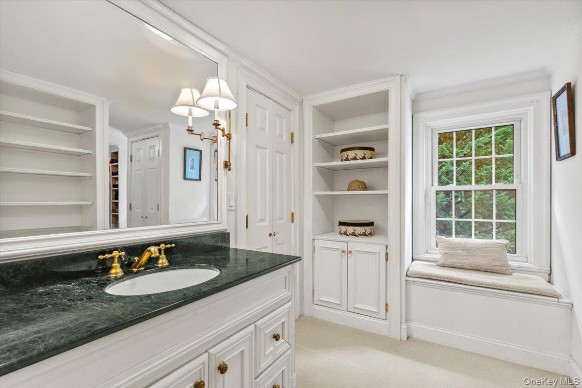655 North Street Harrison, NY 10580 - Photo 19 of 48 a bathroom with a sink and a mirror