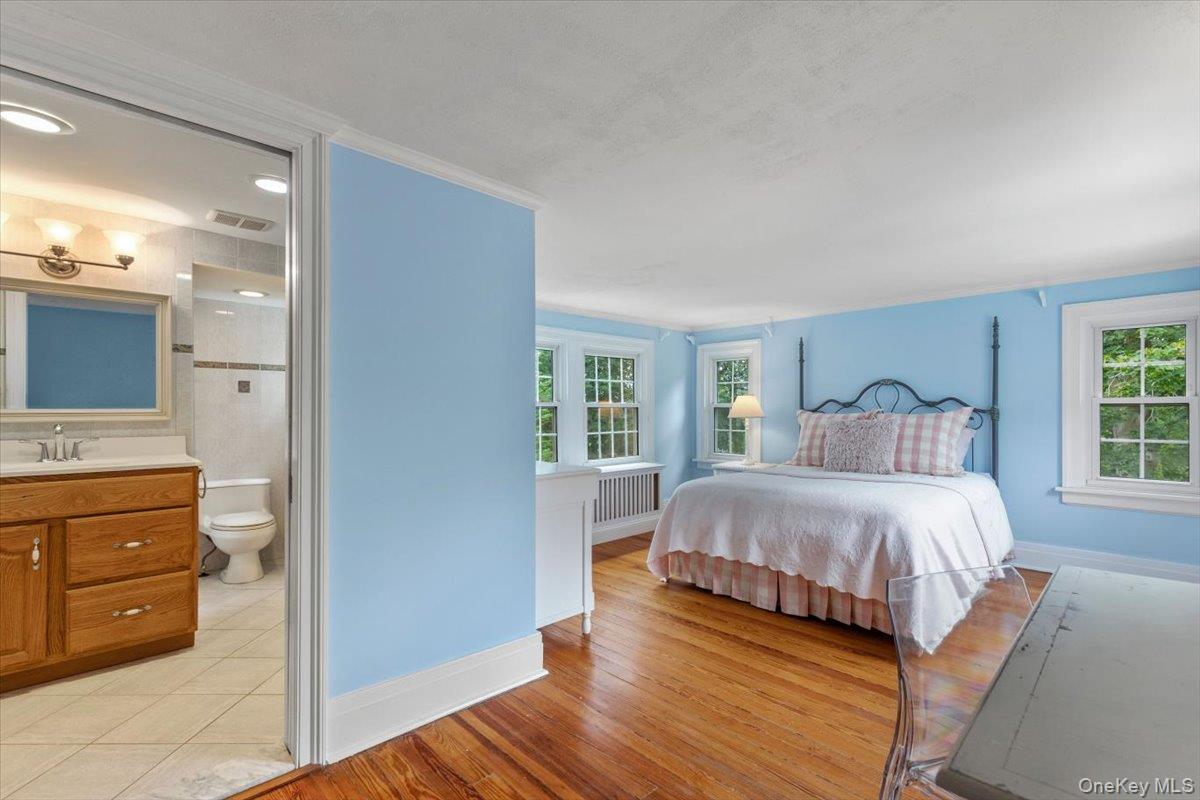 655 North Street Harrison, NY 10580 - Photo 21 of 48 a bedroom with a bed and a dresser