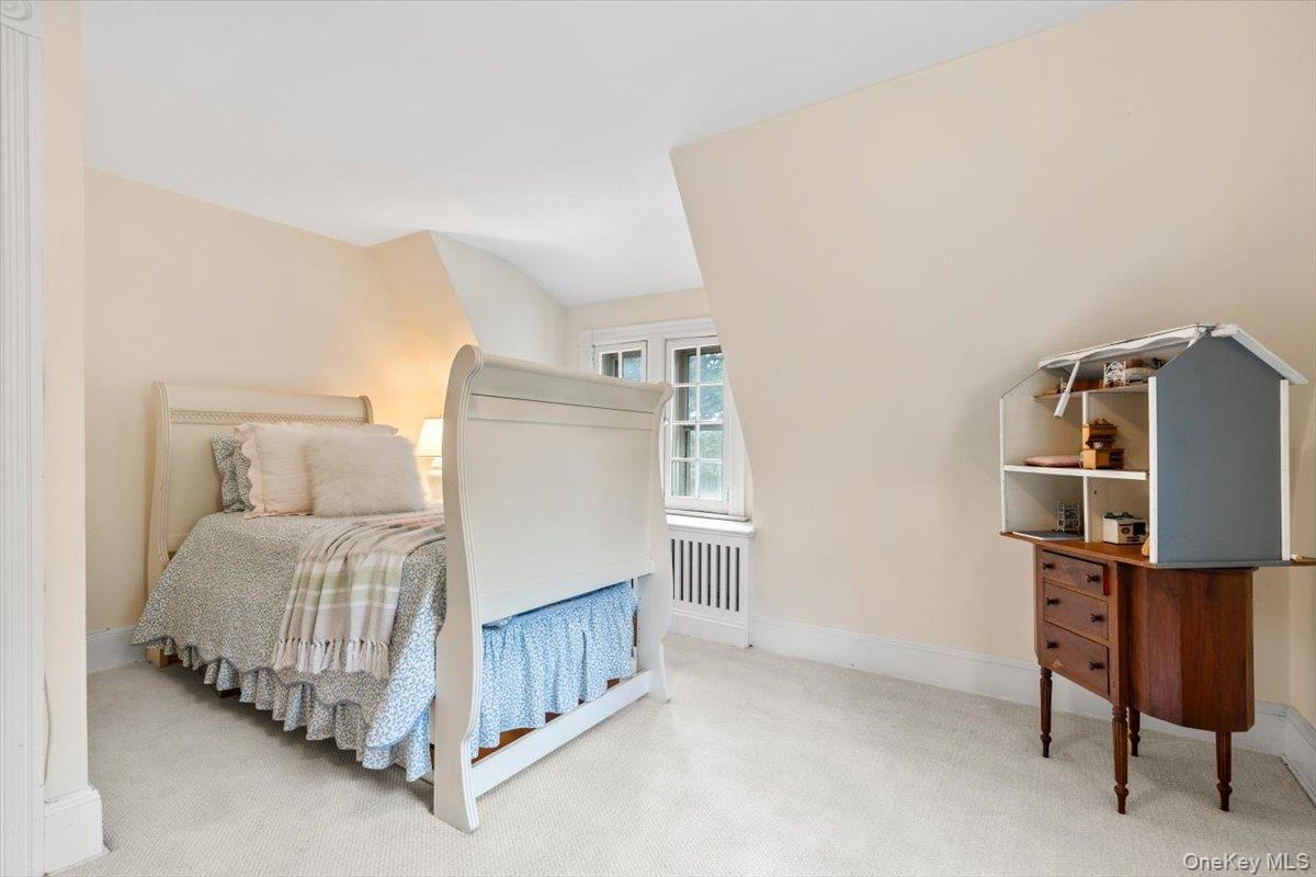 655 North Street Harrison, NY 10580 - Photo 29 of 48 a bedroom with a bed and a chair