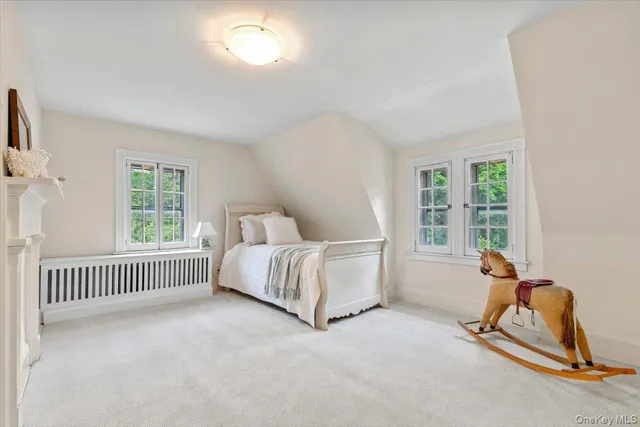 a bed room with a bed and a window