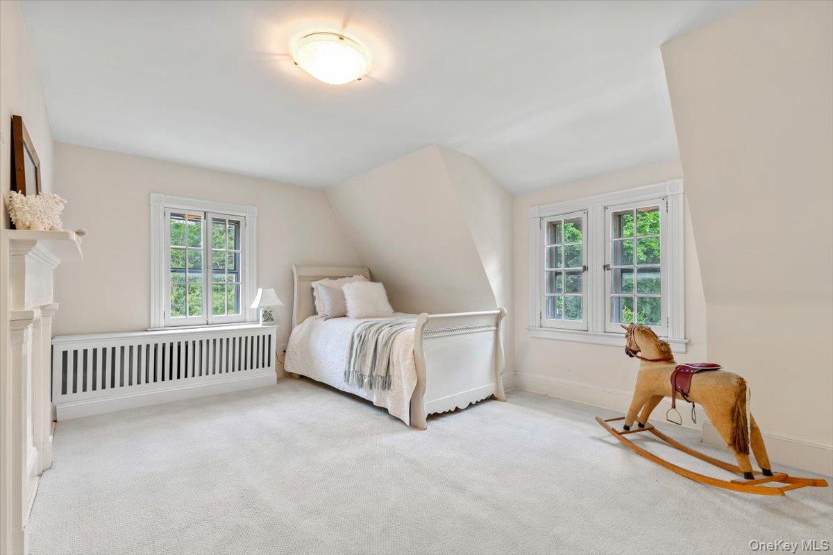 655 North Street Harrison, NY 10580 - Photo 30 of 48 a bed room with a bed and a window