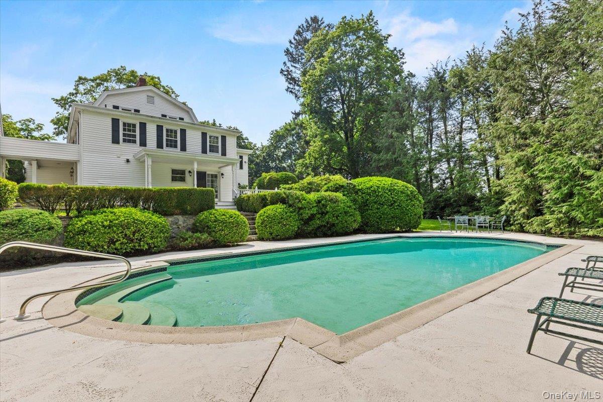 655 North Street Harrison, NY 10580 - Photo 35 of 48 a front view of a house with a yard and trees