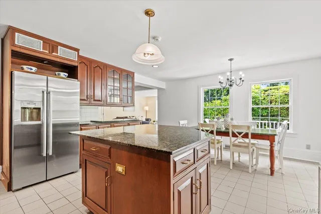a kitchen with a counter space a sink appliances and a counter top space