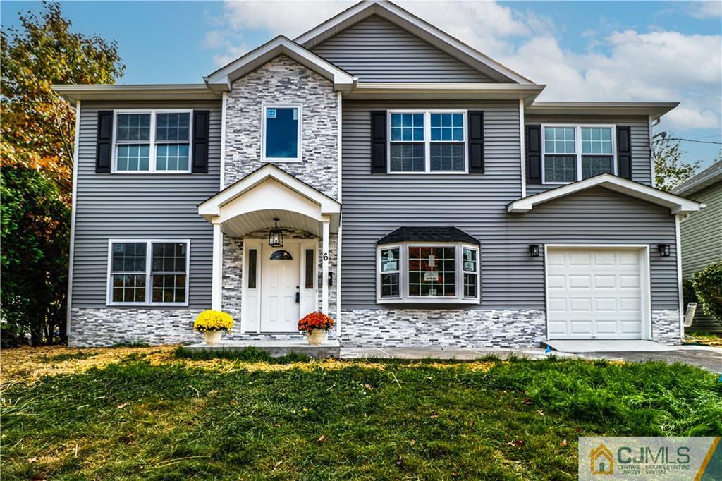 6 Dayton Road Edison, NJ 08817 - Photo 1 of 38 a front view of a house with garden