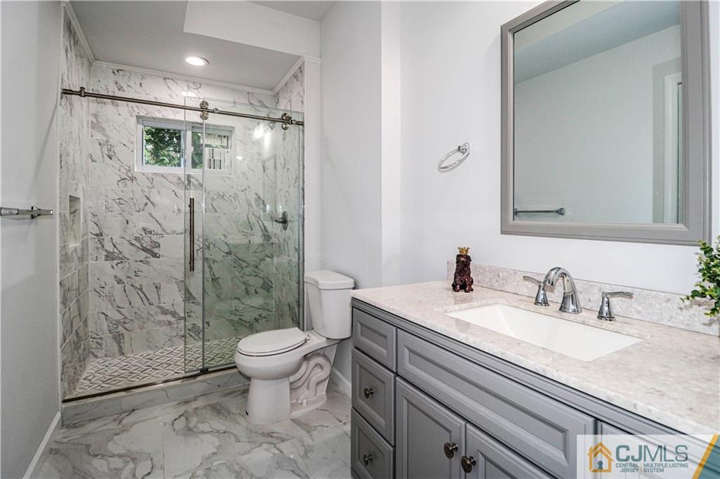 6 Dayton Road Edison, NJ 08817 - Photo 11 of 38 a bathroom with a sink toilet and shower
