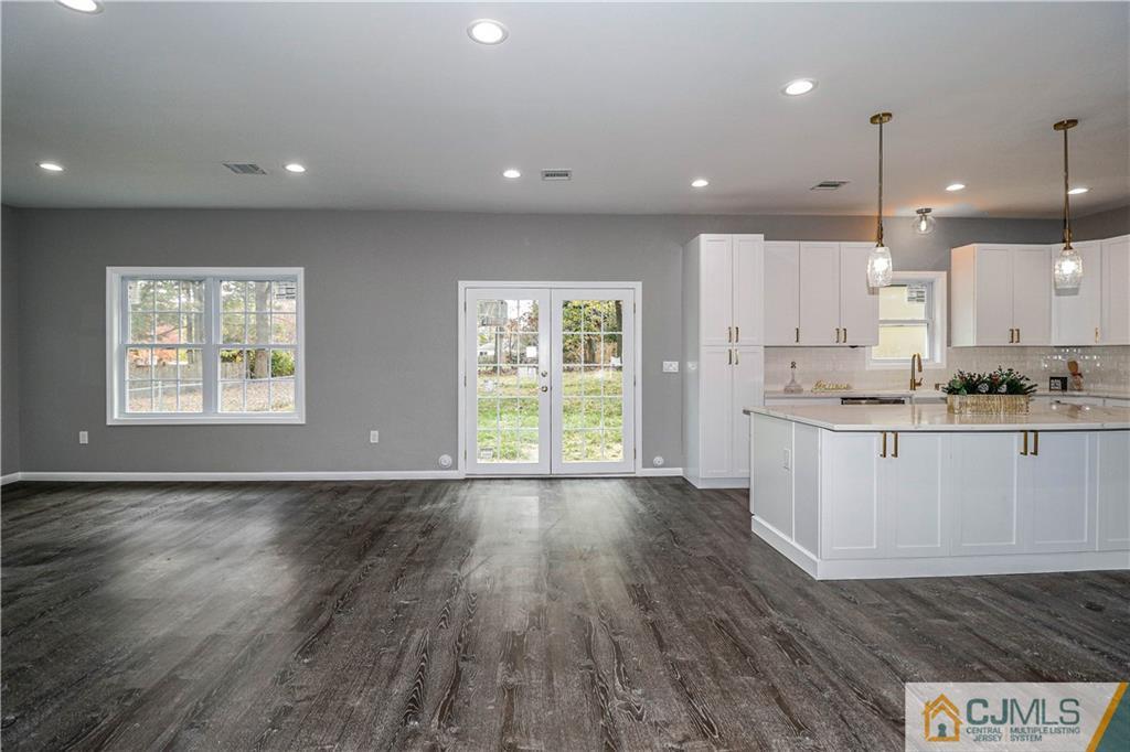 6 Dayton Road Edison, NJ 08817 - Photo 14 of 38 a view of large kitchen with large window and wooden floor