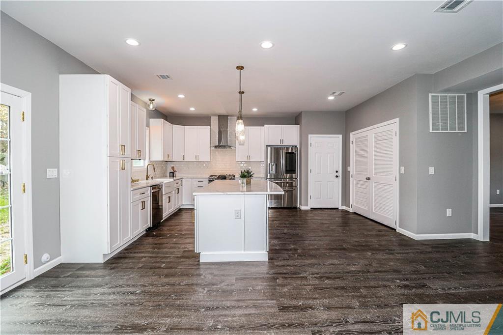 6 Dayton Road Edison, NJ 08817 - Photo 18 of 38 a large kitchen with cabinets and stainless steel appliances