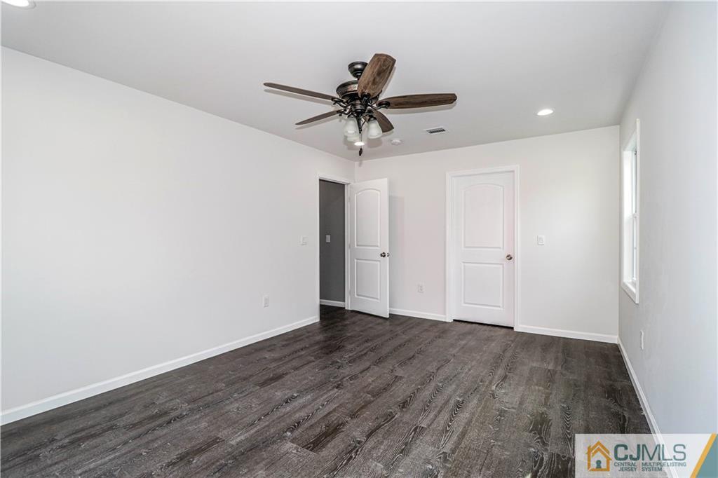 6 Dayton Road Edison, NJ 08817 - Photo 34 of 38 a view of a hallway with wooden floor and chandelier