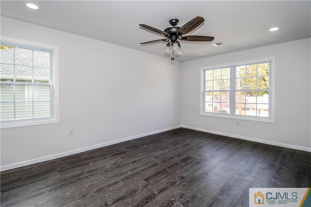 6 Dayton Road Edison, NJ 08817 - Photo 35 of 38 a view of a big room with wooden floor and windows