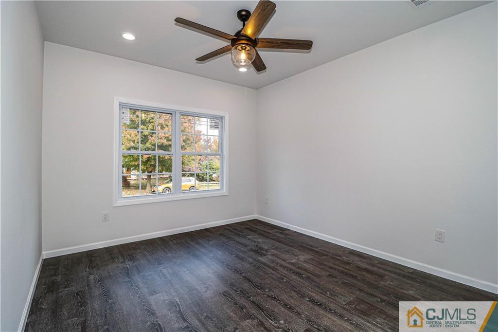 6 Dayton Road Edison, NJ 08817 - Photo 8 of 38 wooden floor in an empty room with a window