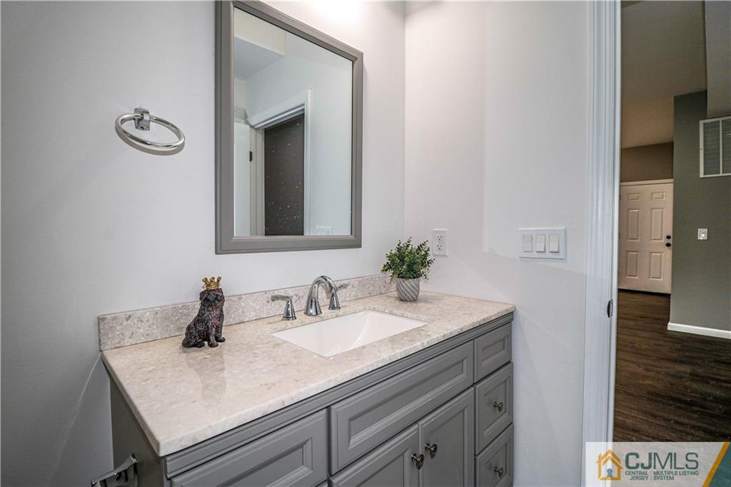 6 Dayton Road Edison, NJ 08817 - Photo 9 of 38 a bathroom with a sink and a mirror
