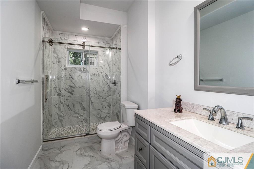 6 Dayton Road Edison, NJ 08817 - Photo 10 of 38 a bathroom with a granite countertop sink toilet and shower