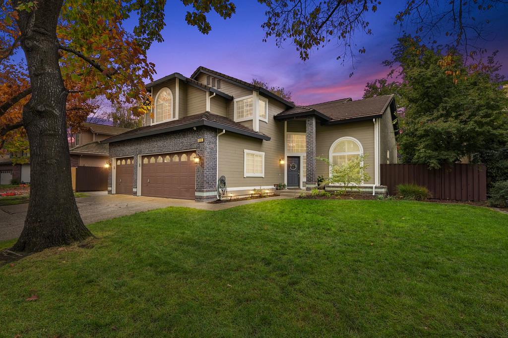 a front view of a house with a yard