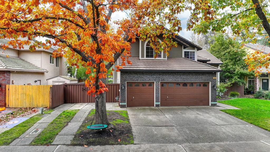 113 Ballast Way Folsom, CA 95630 - Photo 3 of 42 a front view of a house with a garden and trees