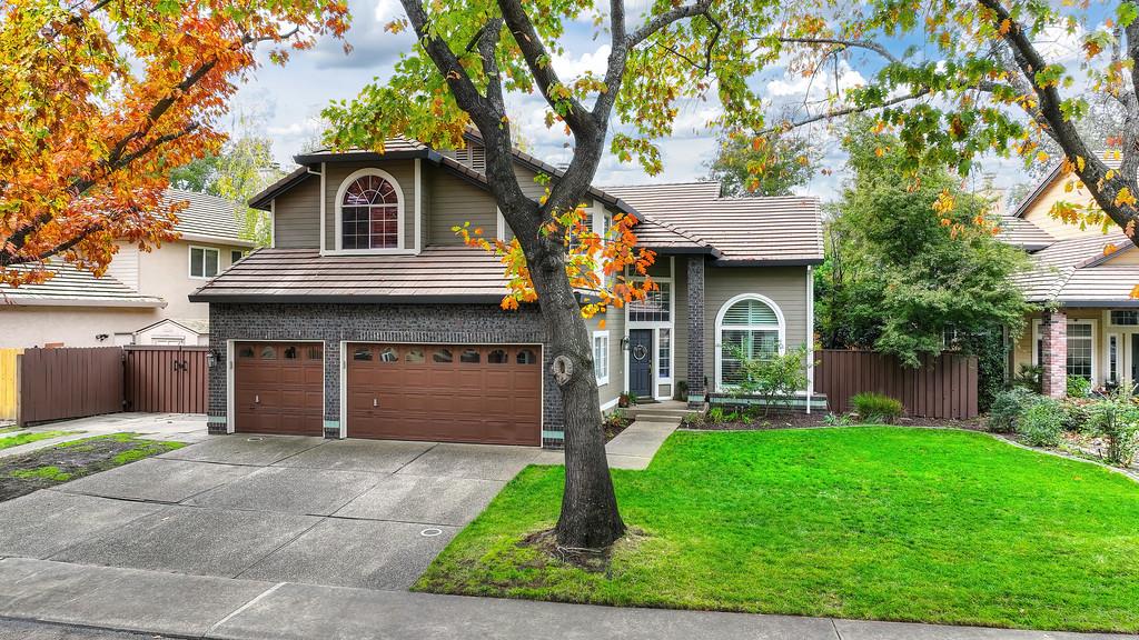 113 Ballast Way Folsom, CA 95630 - Photo 4 of 42 a front view of a house with a yard and garage