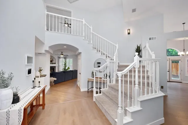 a view of an entryway wooden floor and a livingroom view