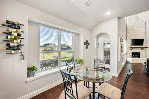 a view of a dining room with furniture window and outside view