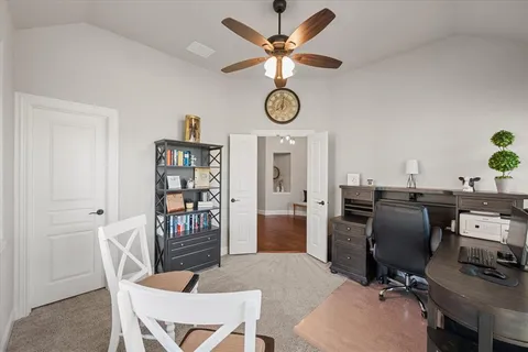 a view of a workspace with furniture