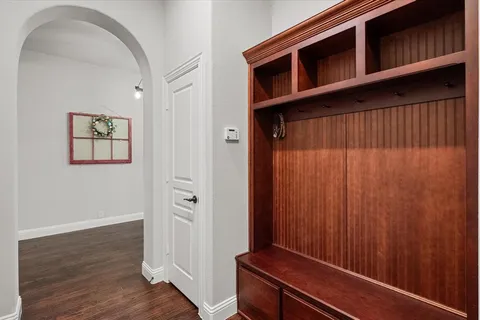a view of an entryway with wooden floor