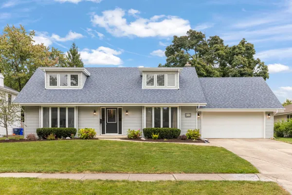 front view of a house next to a yard