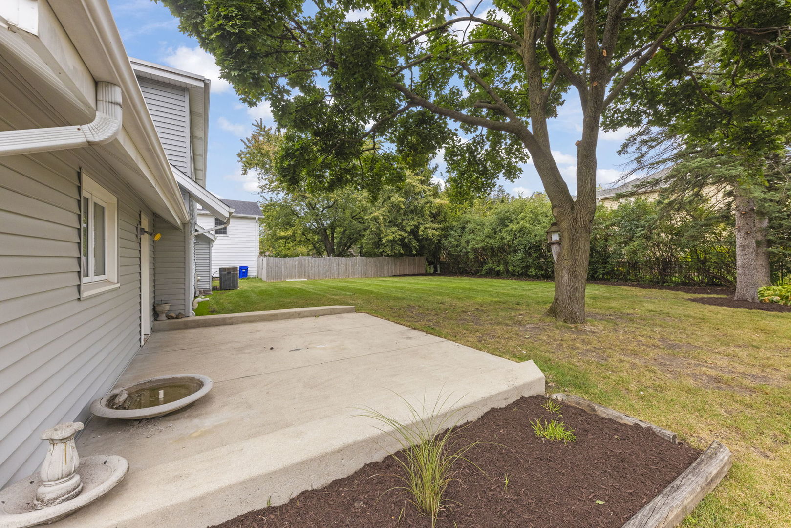 1565 North Summit Street Wheaton, IL 60187 - Photo 2 of 4 a view of a backyard with table and chairs